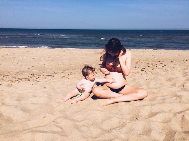 mother son baby bump toddler pregnancy announcement beach sand sea norfolk 