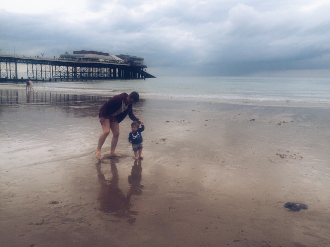 father son beach evening