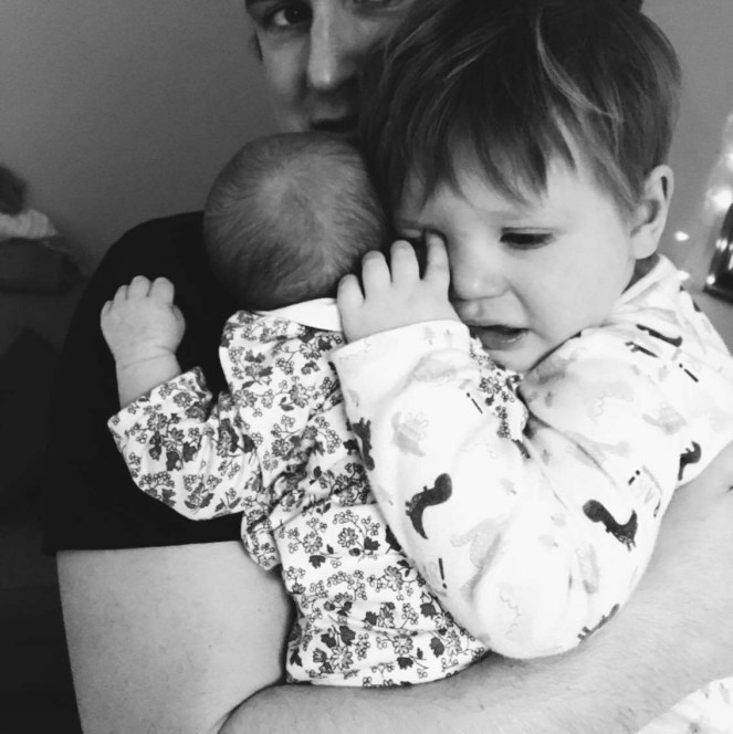 Family of four newborn toddler father brother sister love